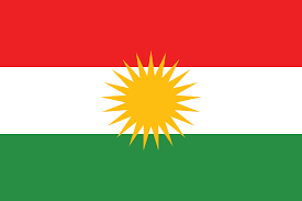 The Kurdish flag with its 21-ray golden sun